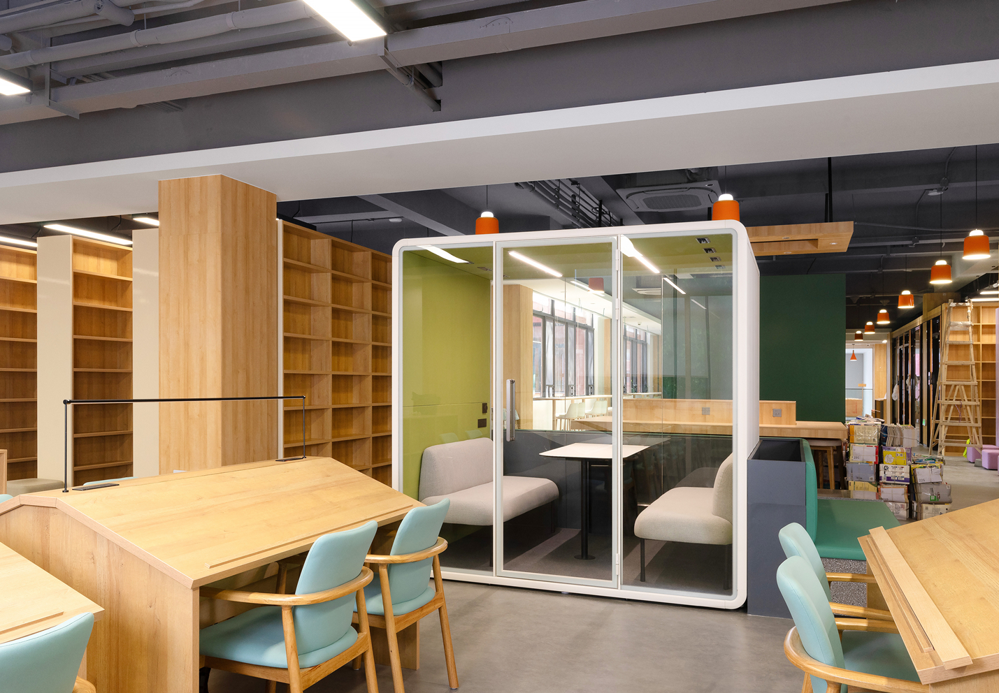 Why are an increasing number of university libraries opting for office pods?